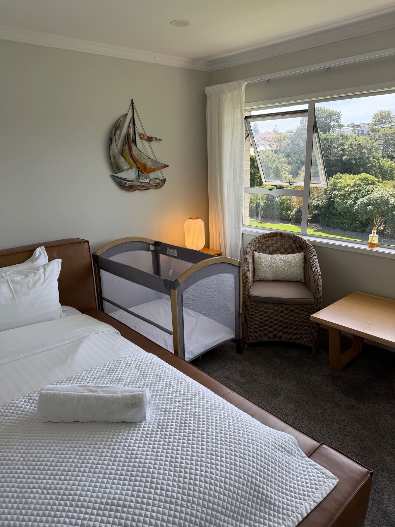 Master bedroom with bassinette set up — travel cot available