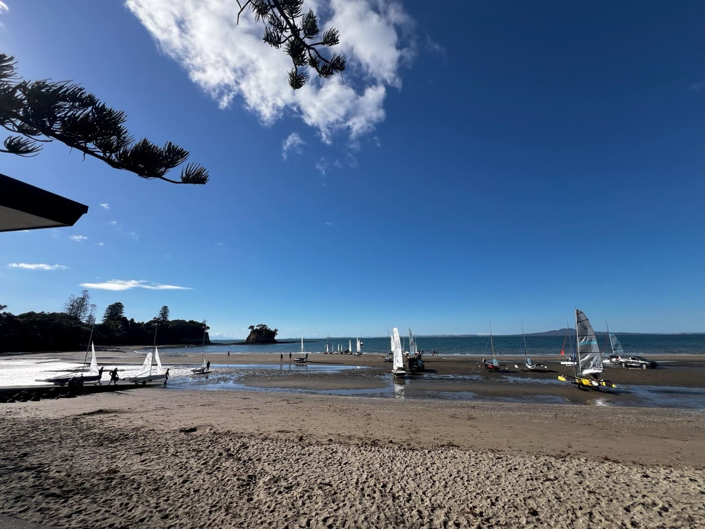 Sailboats on the sand at Waiake Beach
