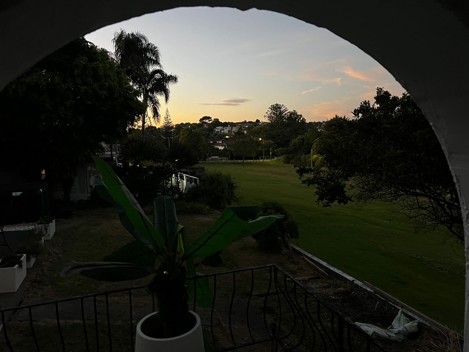 Sunset over the reserve seen through one of the arches