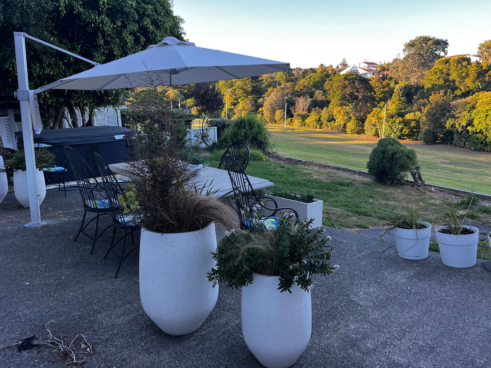 The rear patio set for dinner at golden hour
