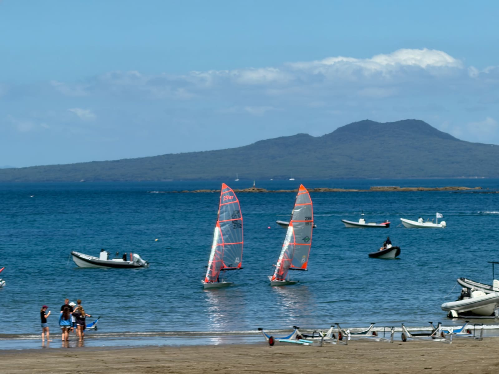 Two 29ers on the water with Rangitoto behind