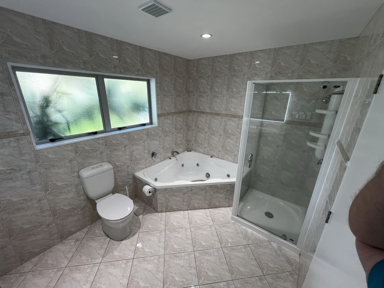 Family bathroom with corner spa bath